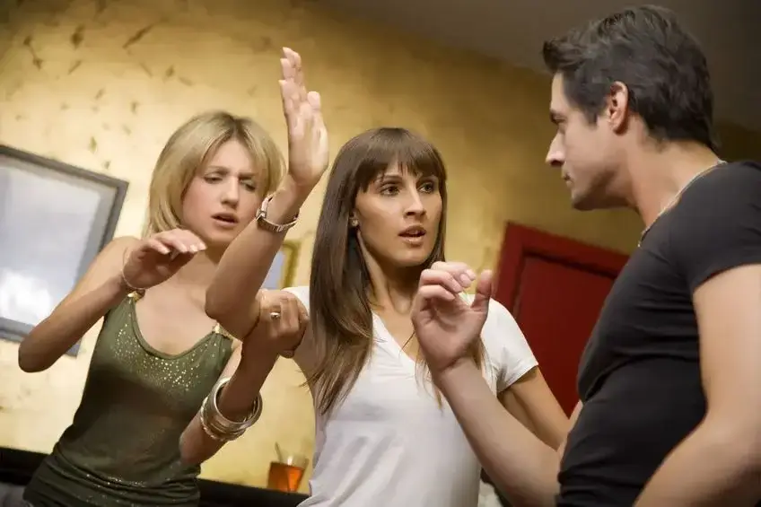 People Arguing in a bar - harassment defense attorney
